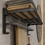 Porte-serviettes mural pliable noir fixé au mur